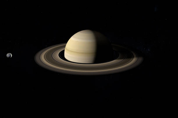 istock Mimas moon orbiting around the Saturn planet. 3d render 1211739845