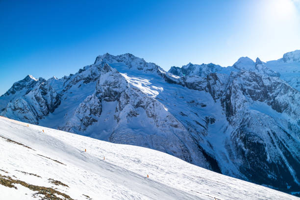 istock Ski Resort against majestic mountain peaks with snow 1211741435
