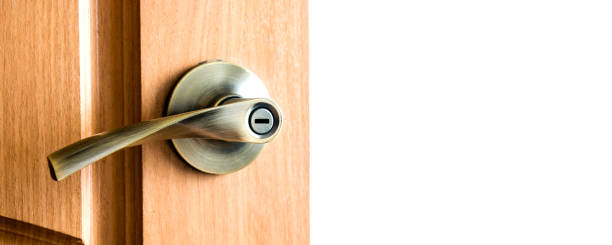 istock Door handle with lock on wooden door 1211744186
