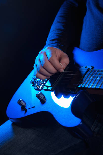 istock musician rock guitarist playing a blue guitar 1211745784