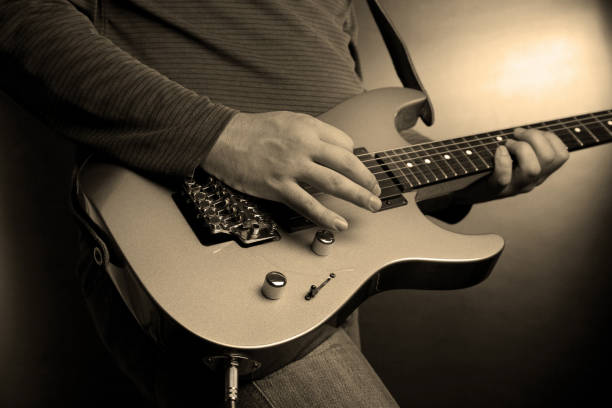 istock musician rock guitarist playing a guitar 1211745818