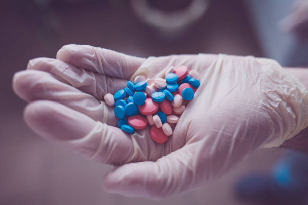 istock Doctor giving pills 1211746433