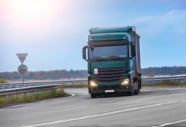 istock truck moves on highway 1211747757