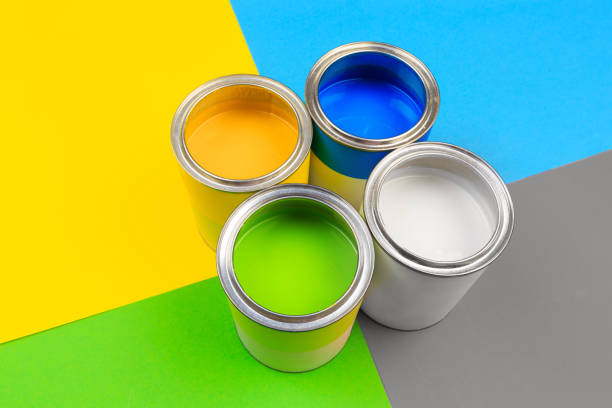 istock Metal paint cans and paint brushes on multicolor background. Top view. Copy space. 1211748806