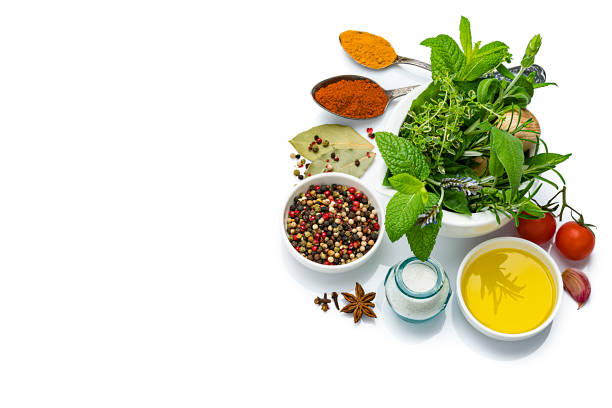 cooking and seasoning ingredients: vegetables, herbs and spices on white background - mortar and pestle condiment isolated food imagens e fotografias de stock