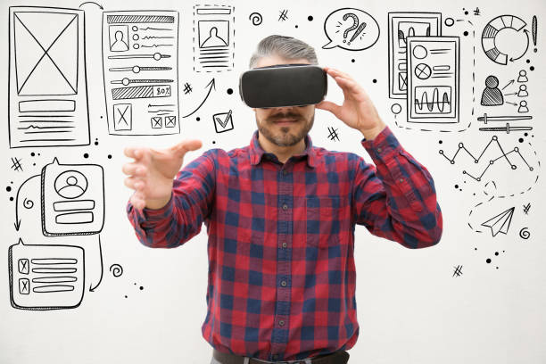 istock Studio shot of young man testing virtual reality headset 1211756378