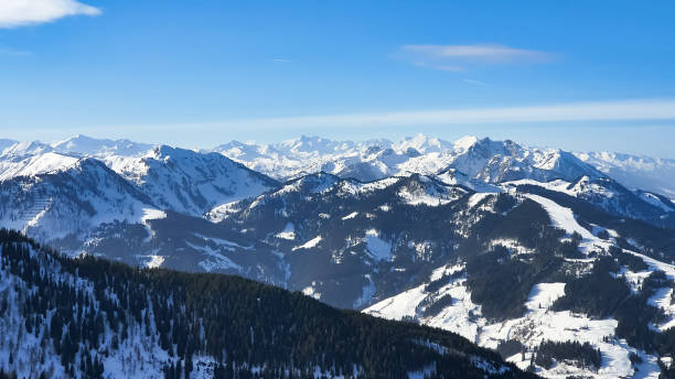 istock Snowy Alps Against Blue sky 1211756700