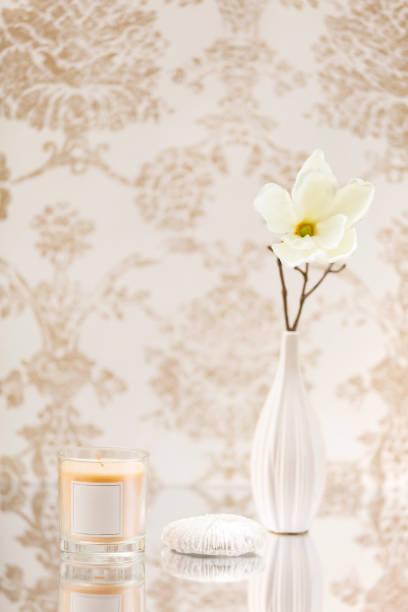 istock Scented candle on classic background with vase with flowers and inspirational items 1211757719