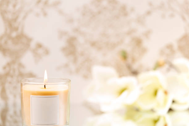 istock Scented candle on classic background with flowers 1211757749