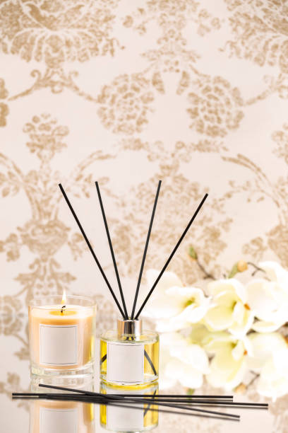 istock Scented oil and Scented candle on classic background with flowers 1211757813
