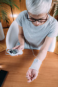 senior-woman-doing-wrist-joint-physical-therapy-with-conductive-tens-electrode-socke.jpg?b=1&s=170x170&k=20&c=NMc7KgSMZVkabLUNhRha1OB8cKDz8bLpPxsiiHsD2jI=