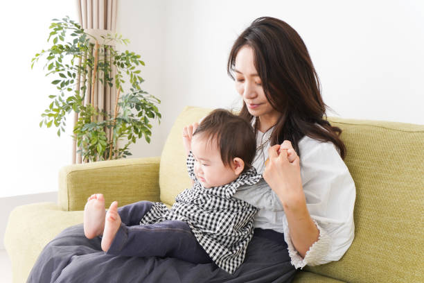 istock Mom and baby relax at home 1211765737