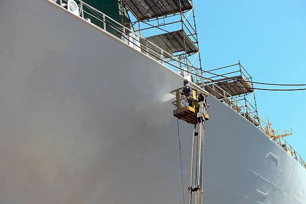 Photo of Worker painting of the ship