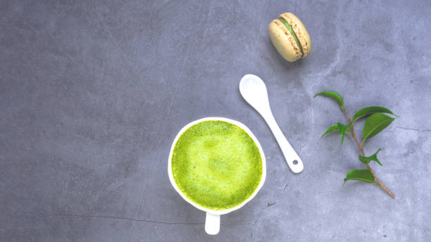 istock French almond cake makarons, green leaf, matcha tea 1211767135