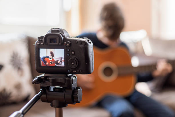 istock Making video guitar lesson at home 1211768712
