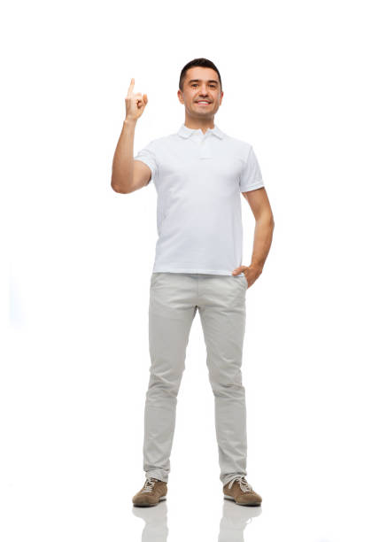 istock smiling man pointing finger up 1211768818