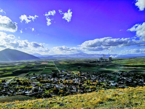 istock lanscape with village and factory 1211768846