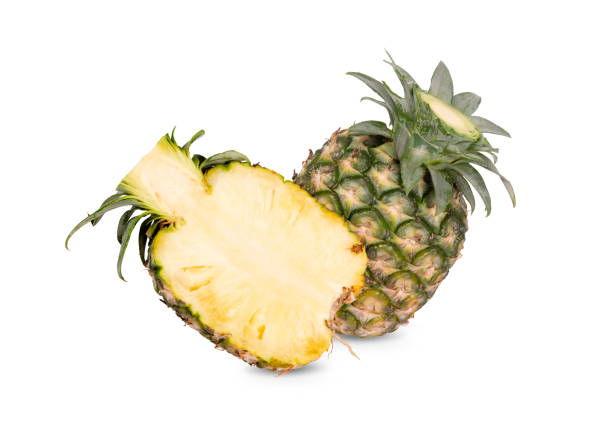 istock whole and half cut unpeeled ripe pineapple on white background 1211773766