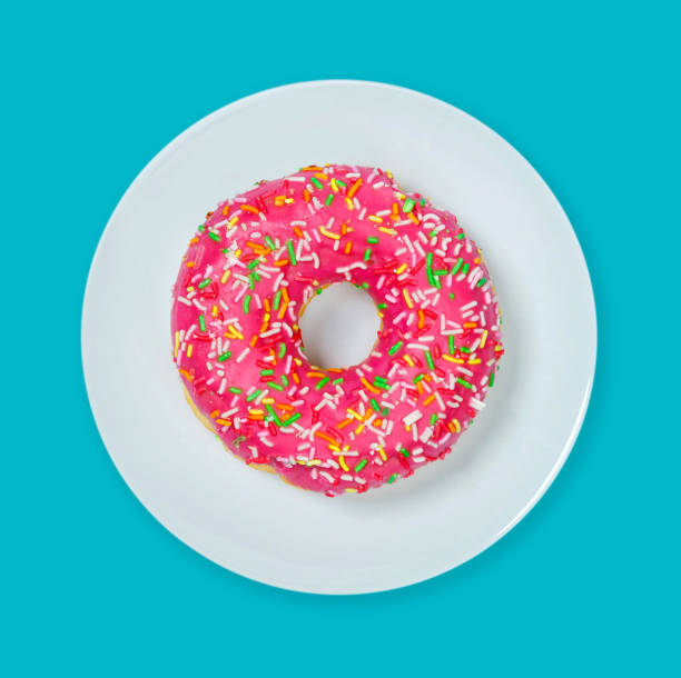 istock Colorful holey donut cake with pink glaze 1211773919