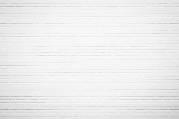 istock White brick wall texture background in room at subway. Brickwork stonework interior, rock old clean concrete grid uneven abstract weathered bricks tile design, horizontal architecture wallpaper. 1211774161