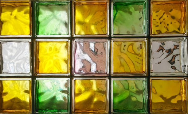 istock Green and yellow glass block wall background 1211774245