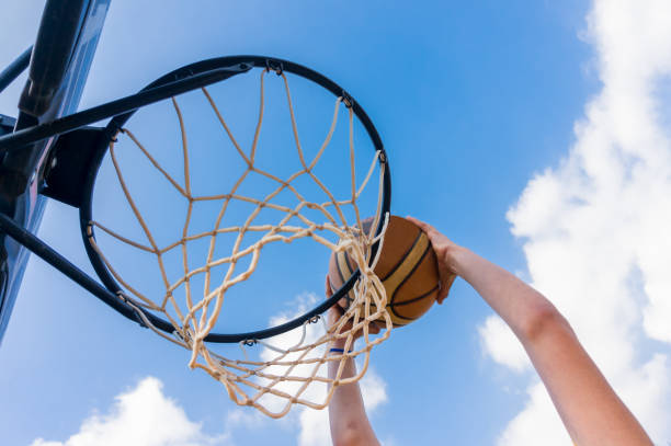 istock Slam dunk in street basketball 1211775126