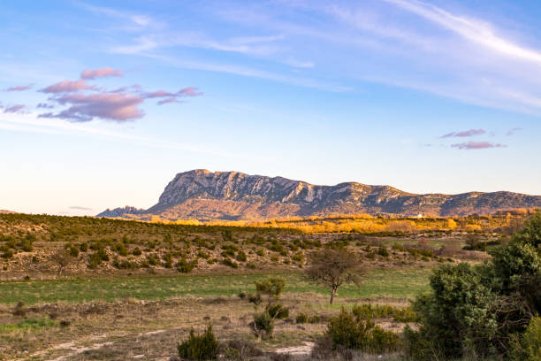 istock North face of Pic Saint-Loup, illuminated by the setting sun (Occitanie, France) 1211775143