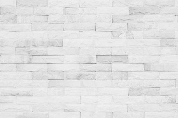 istock Medieval natural stone wall texture background or boundary the rock seamless abstract and decor fragment of design vintage wallpaper pattern chipped ancient from white color for interior copy space. 1211775183