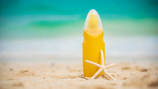 istock Sunscreen lotion protect woman skin under sunlight burn with uv spf moisturizer on tropical summer outdoor beach. Cosmetic sunblock water resistant tanning wellness factor for woman sunscreen lotion 1211775685