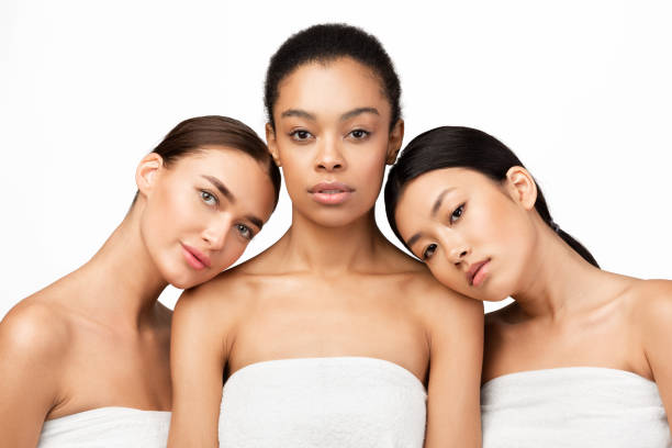 istock Three Sensual Girls Wrapped In Bath Towels Posing, Studio Shot 1211775725