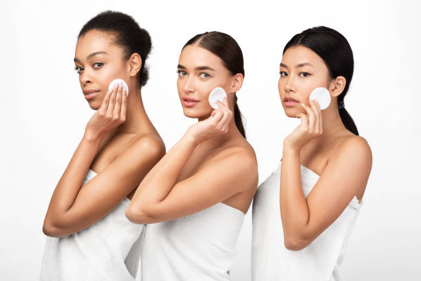 istock Three Women Using Cotton Pads Posing In Towels, Studio Shot 1211776340