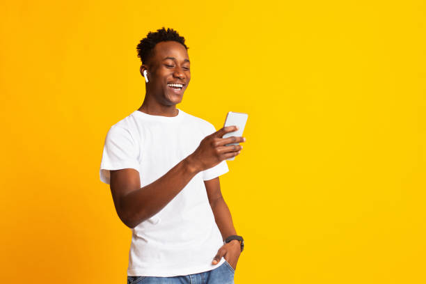 Young cheerful afro guy having video call