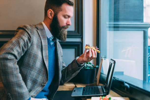 istock Businessman working in cafe 1211777196