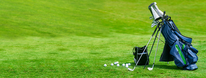 Bag of golf clubs on the golf course banner format