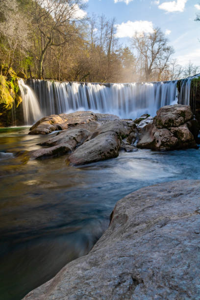 istock Vis waterfall at the end of winter in long exposure (Occitanie, France) 1211779610