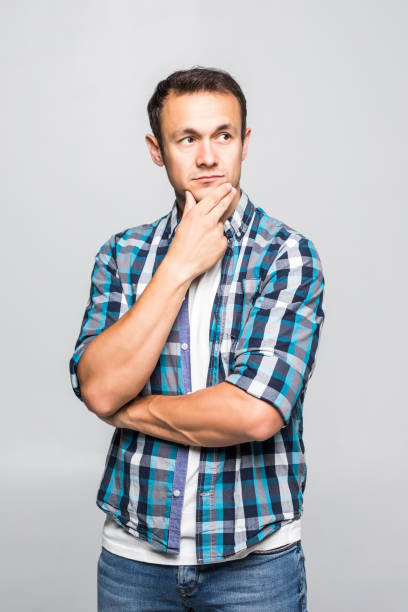 istock Young man with plaid shirt. confidence gesture isolated on white background 1211783165
