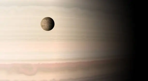 The tiny Jovian moon of Europa, drifting across the huge face of Jupiter. Composite/computer generated image.