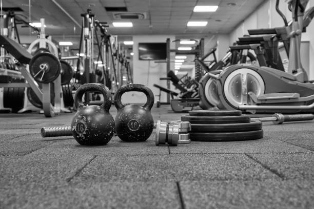 istock Dumbbells and kettlebells on a floor. 1211783632