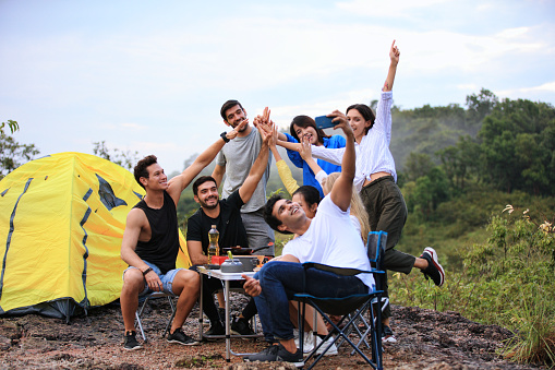 group of close friend to selfi photo during party and camping at outdoor