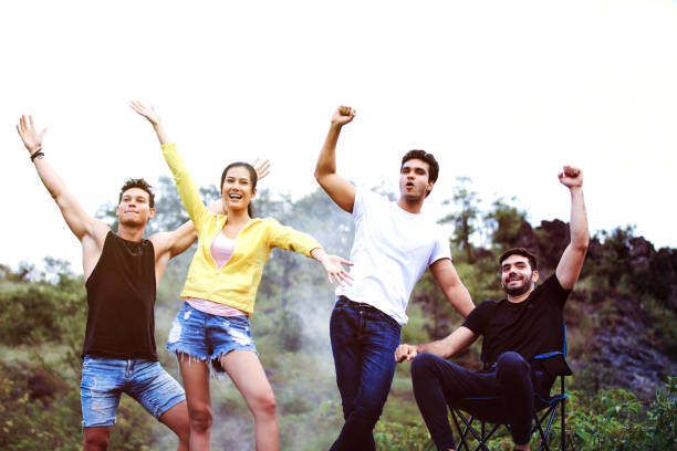 Close friend group feel funny and happy during their camping
