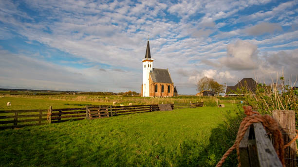istock Texel landscape with a church 1211784623