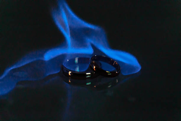 wedding rings in a blue flame of fire. Wedding. Traditions.