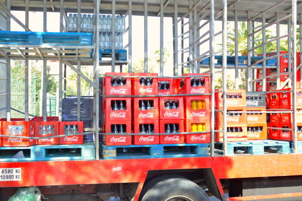 Los Cristianos, Tenerife, Spain- February 07, 2020: Coca-cola company deliver soft drinks. Boxes bottles stored on the truck.