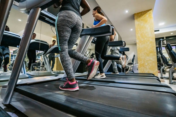 istock People running on treadmill in gym 1211788597
