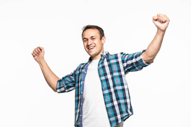istock Happy winner. Happy young handsome man gesturing and keeping mouth open while standing against on white background 1211789519