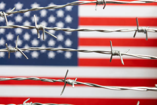 istock American Flag and Barbed Wire 1211789802
