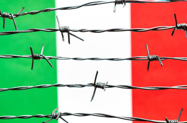 Italy Flag and barbed wire. Immigration concept. Border security.
