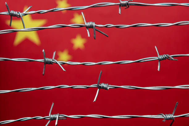 Chinese Flag and Barbed Wire stock photo