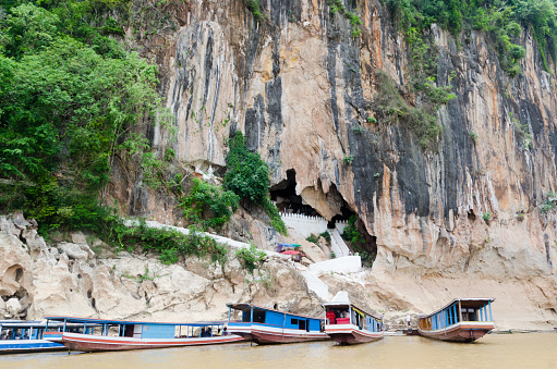 The Pak Ou Caves, known as the Cave of a Thousand Buddhas, are located on a cliff along the Mekong river, some 20 km north of Luang Prabang.
