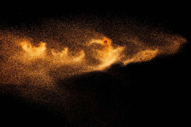 istock Brown colored sand splash.Dry river sand explosion isolated on black background. Abstract sand cloud. 1211792134
